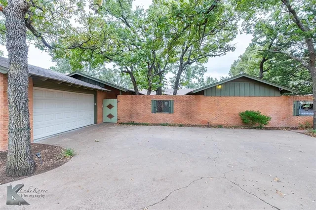 a house with trees in front of it