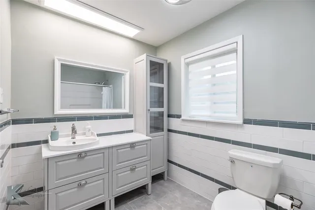 a bathroom with a shower and a toilet