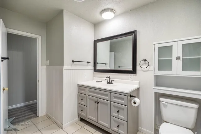 a white bath tub sitting next to a shower