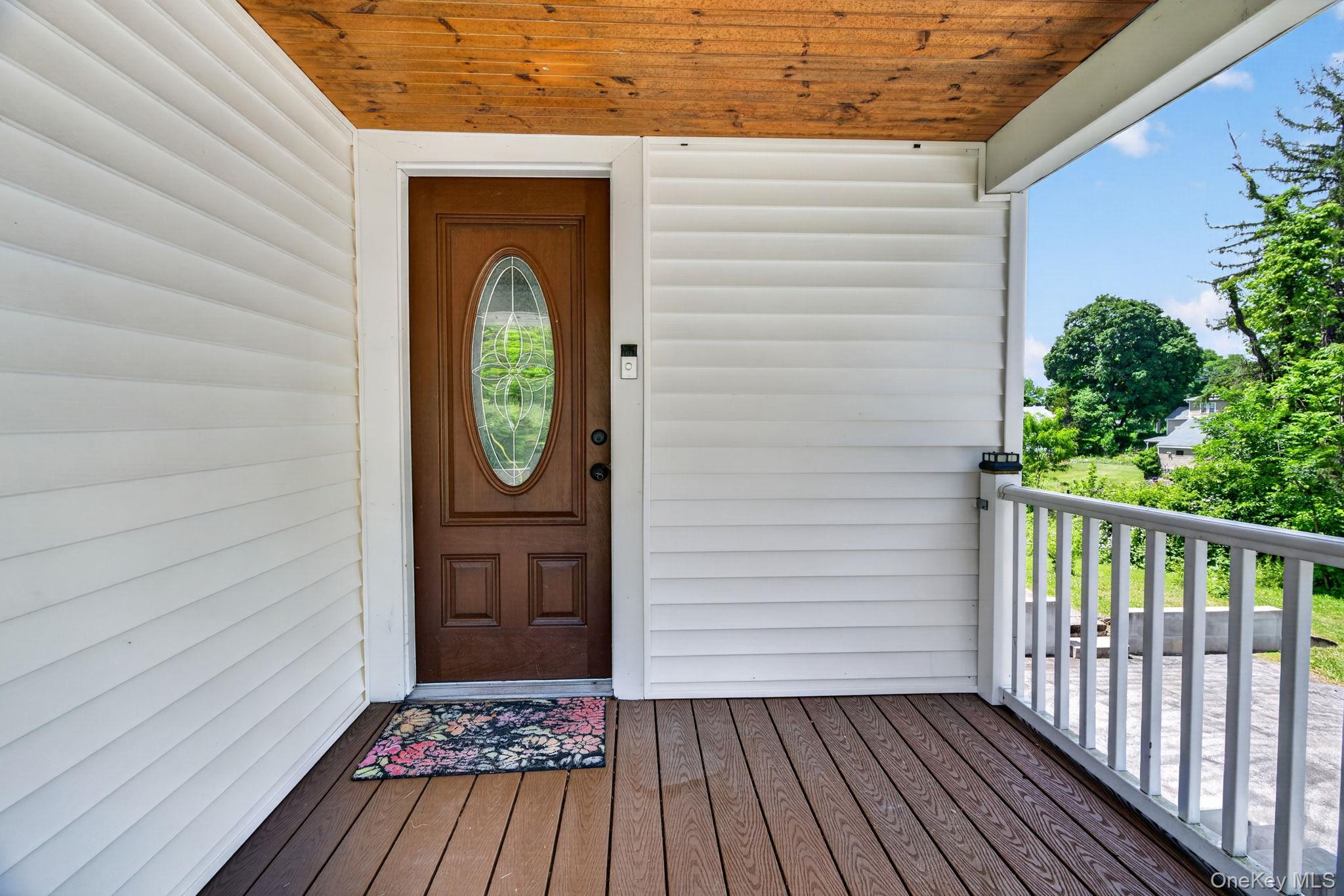 7 Walnut Street Poughkeepsie, NY 12601 - Photo 5 of 30 The charming front porch perfectly complements the timeless appeal of this Cape Cod home, creating a warm and welcoming first impression.