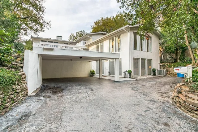 a view of a house with a yard and garage