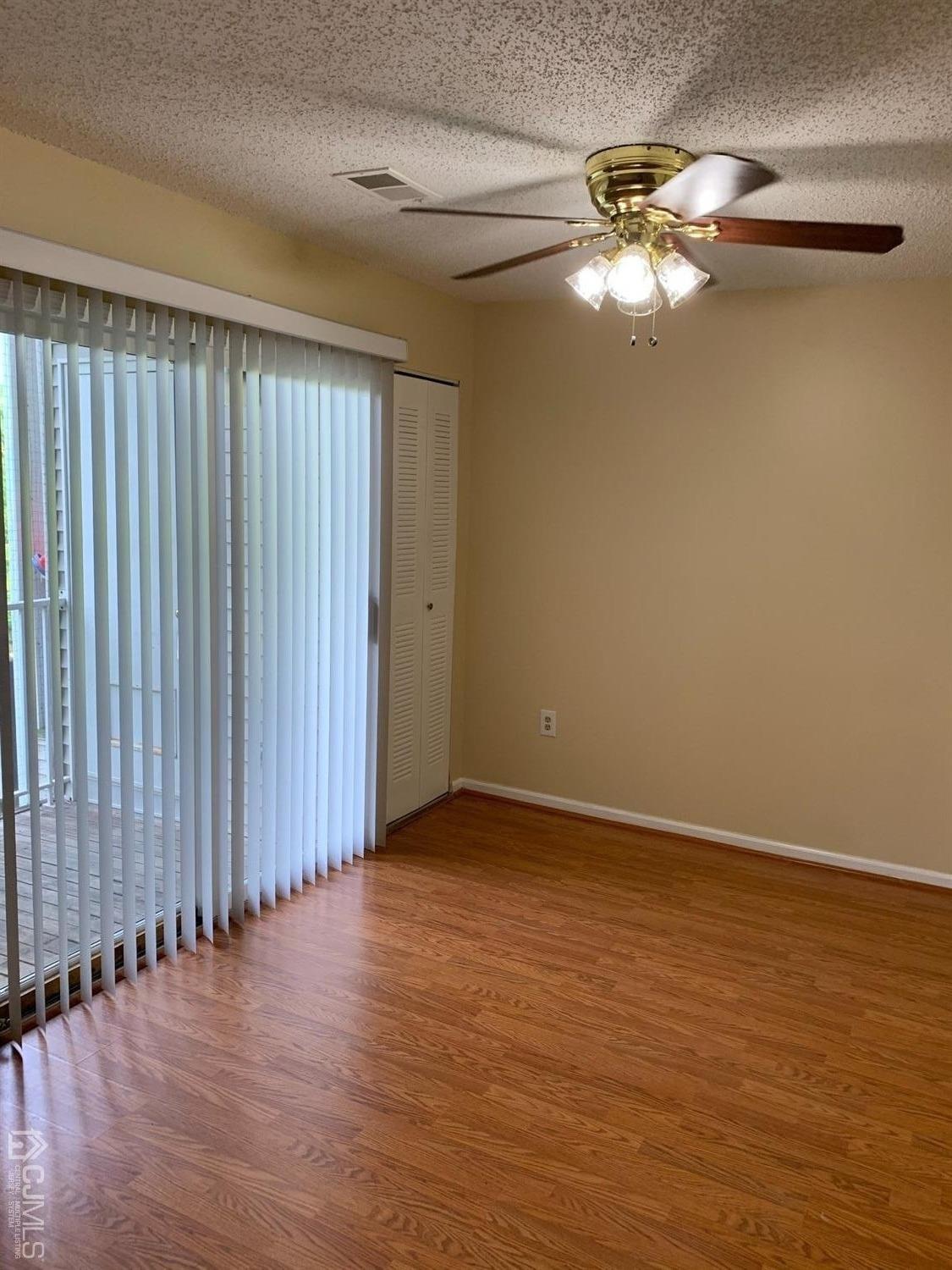 1226 Edpas Road New Brunswick, NJ 08901 - Photo 17 of 18 a view of an empty room with wooden floor