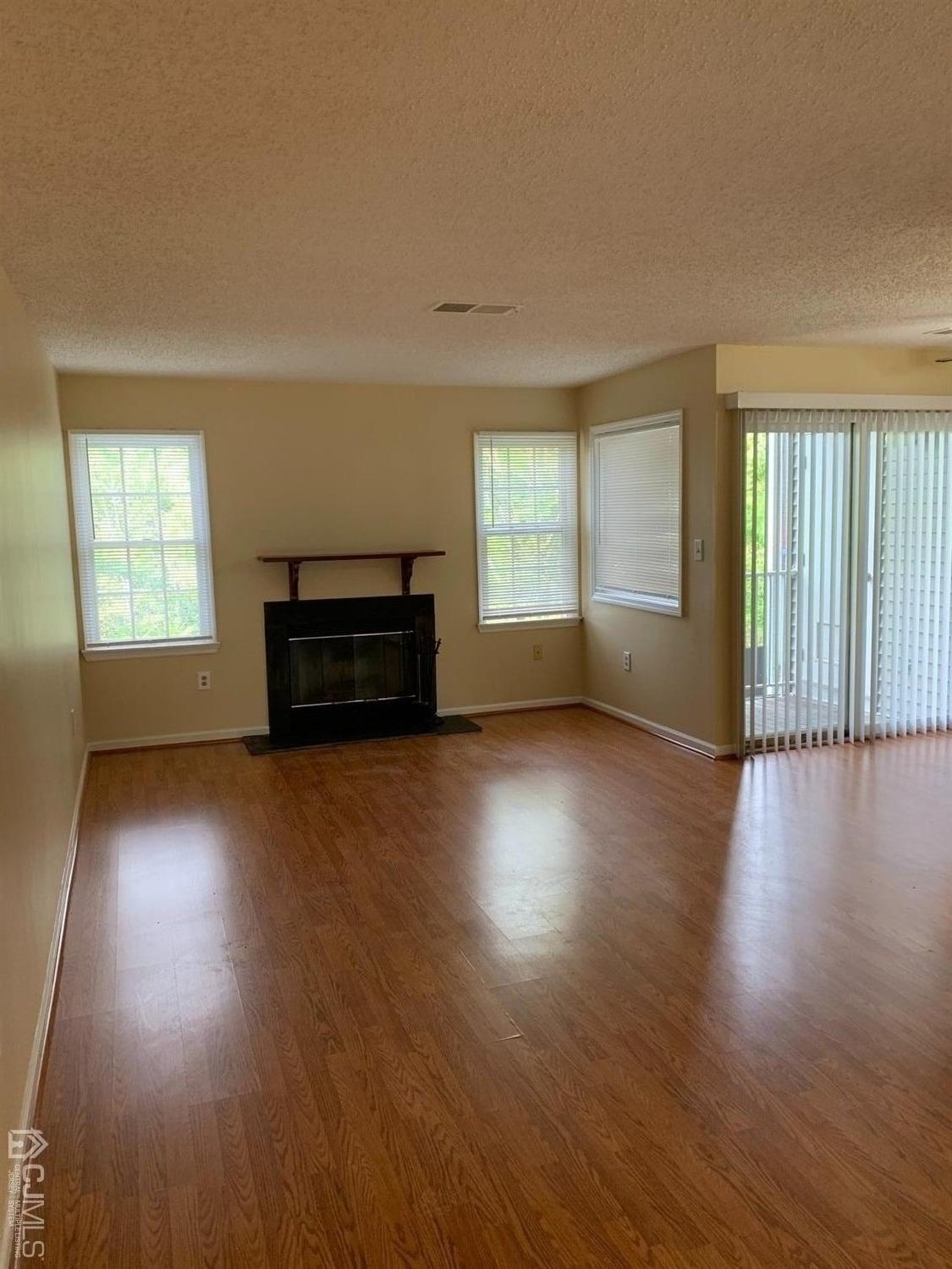 1226 Edpas Road New Brunswick, NJ 08901 - Photo 10 of 18 a view of empty room with wooden floor and fan