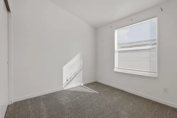 an empty room with windows