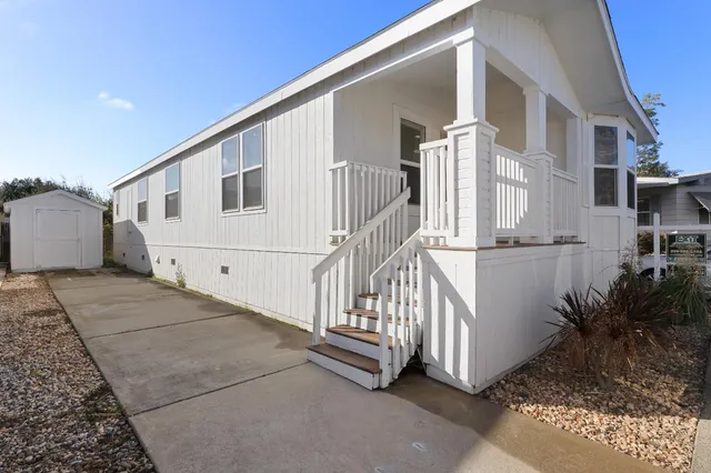 a view of a house with entryway and wooden floor