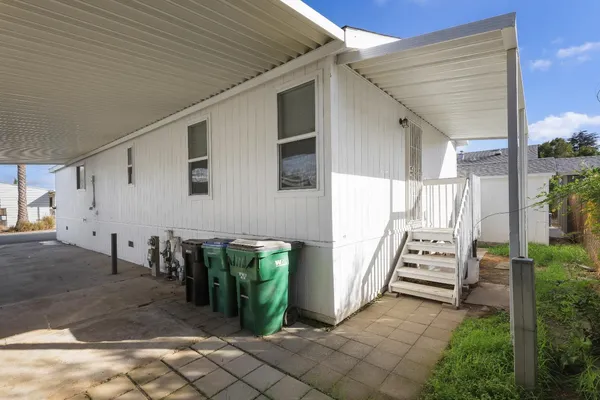a view of a porch with seating space
