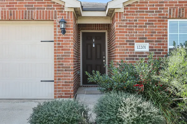 a view of a building with potted plants