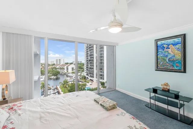 a kitchen area with granite countertop a sink and cabinets