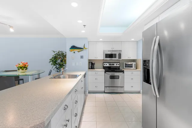 a kitchen with appliances cabinets and a sink