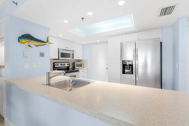 a bedroom with a large bed and a balcony view