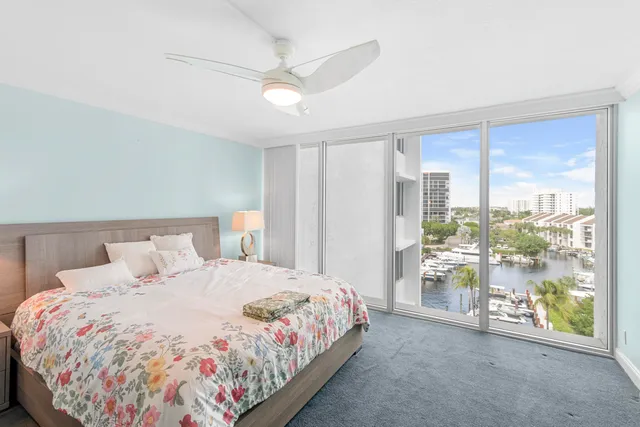 a bedroom with a bed and a mirror