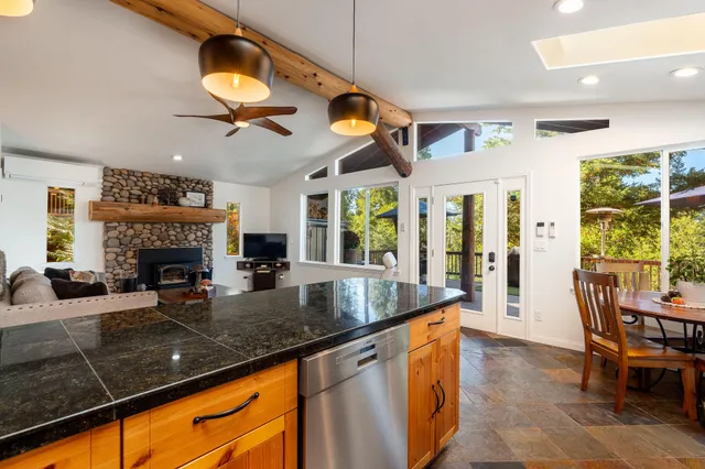 a view of a porch with furniture and a yard