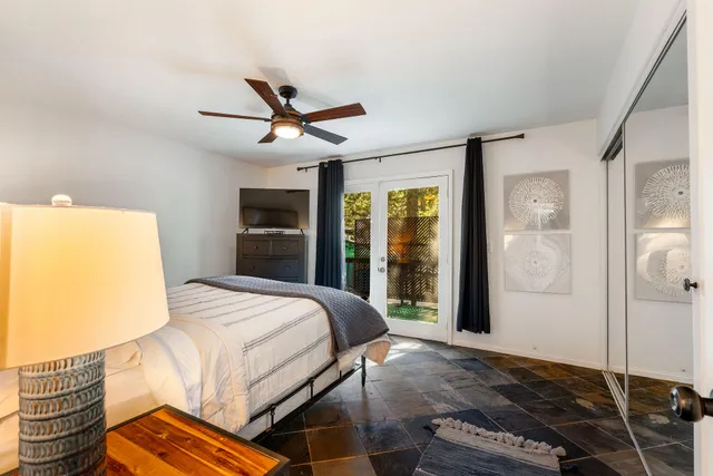 a living room with fireplace furniture and a wooden floor