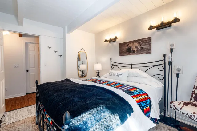 a view of a chairs and table in the backyard