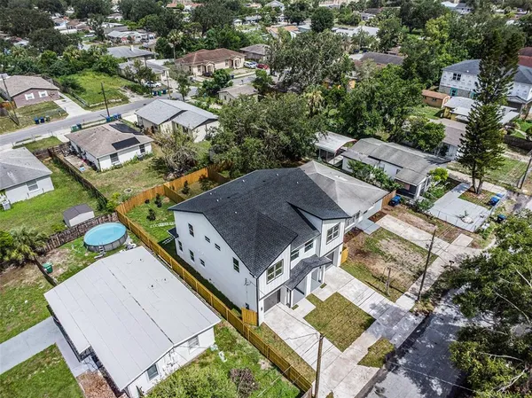 an aerial view of a house with a outdoor space
