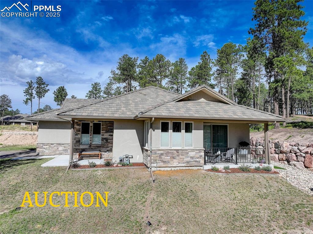 3144 Promise Point Colorado Springs, CO 80921 - Photo 1 of 1 a front view of a house with yard porch and furniture
