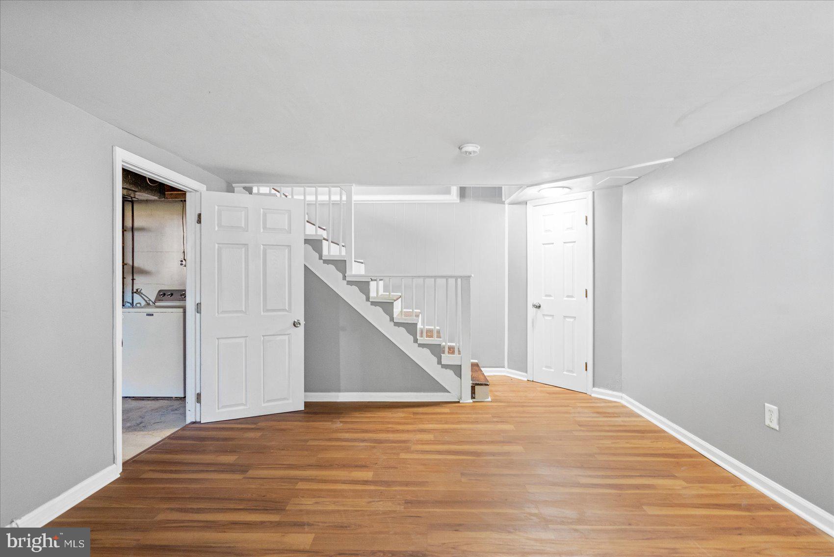 11 Cardinal Road Baltimore, MD 21221 - Photo 14 of 37 a view of a room with wooden floor and staircase