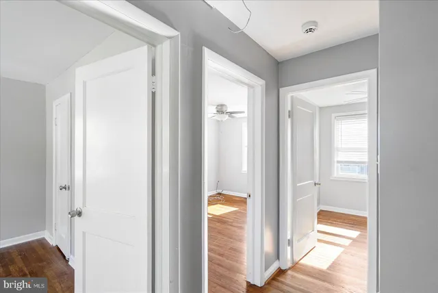 a view of a bathroom from a hallway