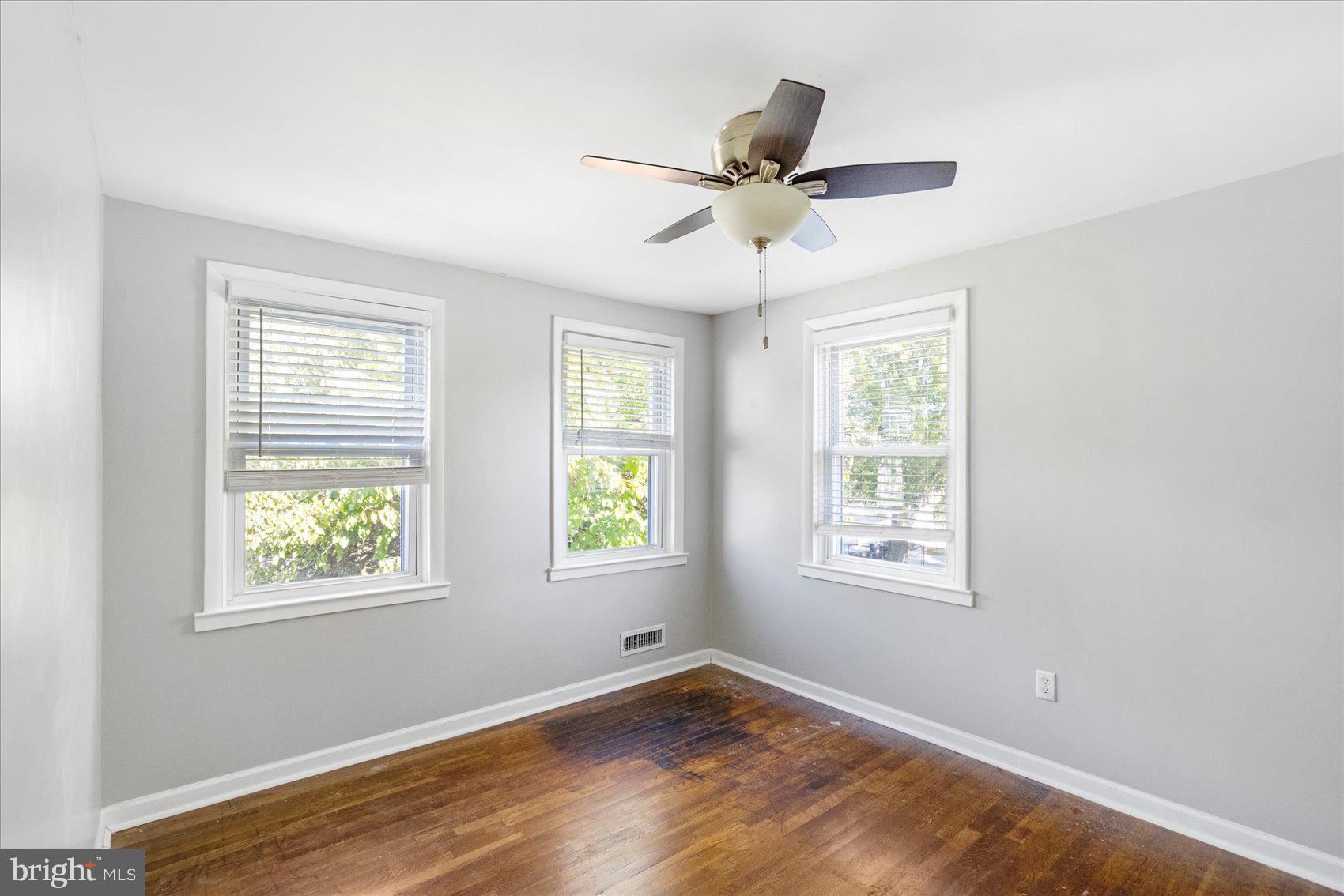 11 Cardinal Road Baltimore, MD 21221 - Photo 25 of 37 a view of an empty room with wooden floor and a window