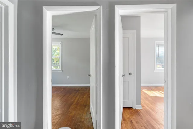 a view of a bathroom from a hallway