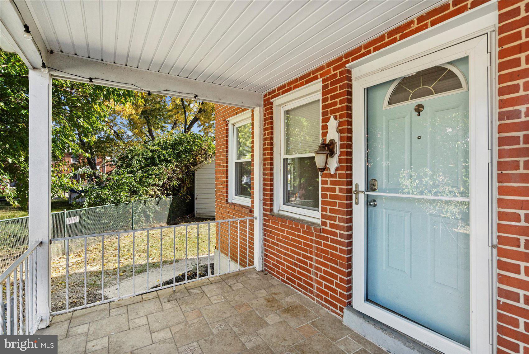 11 Cardinal Road Baltimore, MD 21221 - Photo 3 of 37 a view of a porch with a door and wooden floor