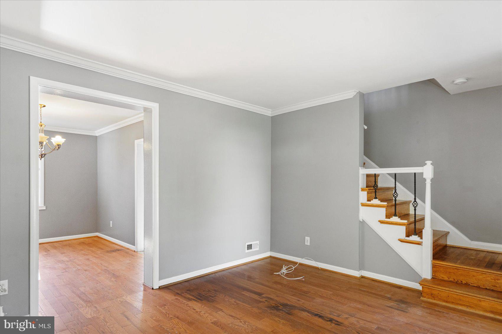 11 Cardinal Road Baltimore, MD 21221 - Photo 7 of 37 an empty room with wooden floor and entrance