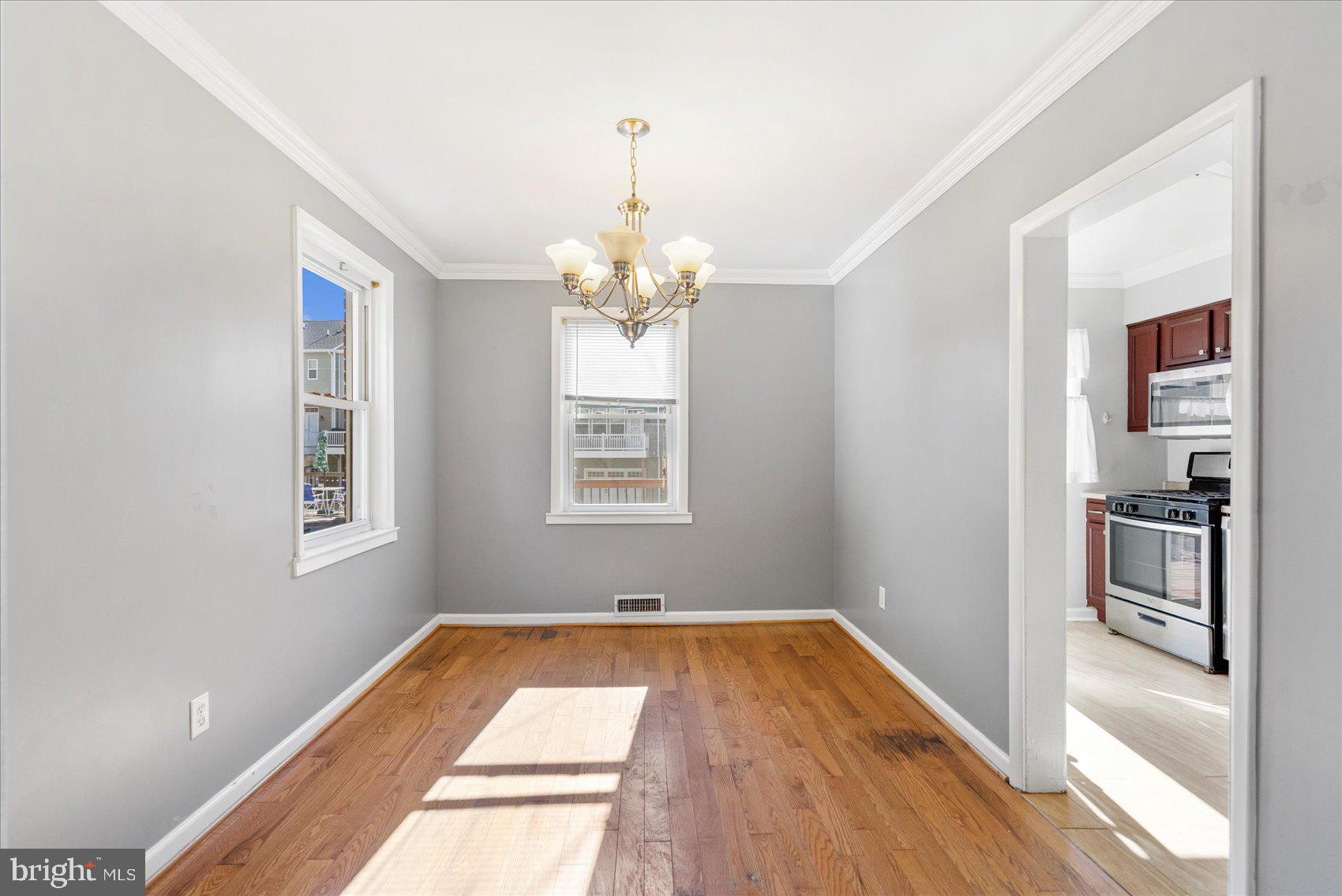 11 Cardinal Road Baltimore, MD 21221 - Photo 8 of 37 a view of a room with wooden floor and windows