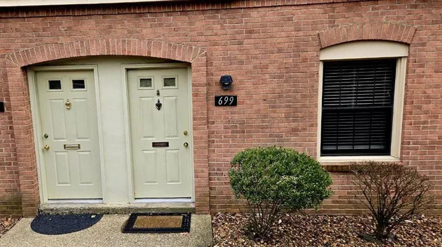 a front view of a house with a shower