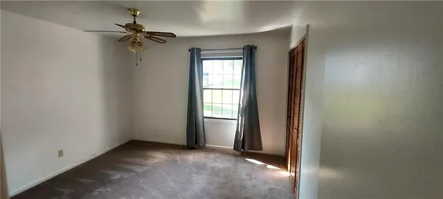a view of empty room with windows