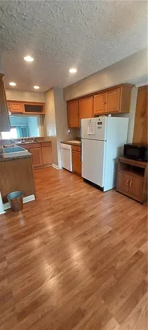 a view of room with wooden floor