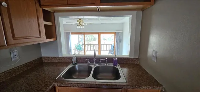 a kitchen with a sink and window