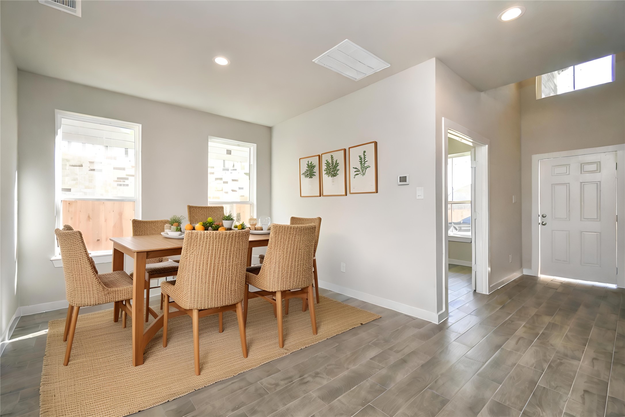 15119 Statice Trail Houston, TX 77044 - Photo 9 of 26 a view of a dining room with furniture and wooden floor