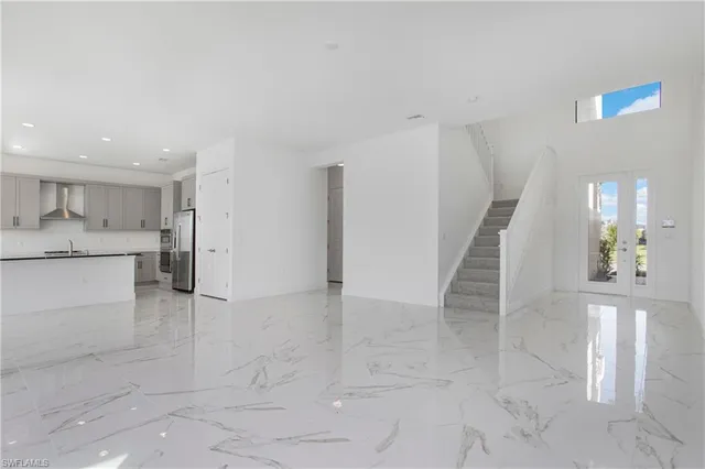 a view of a kitchen with an empty space and a window