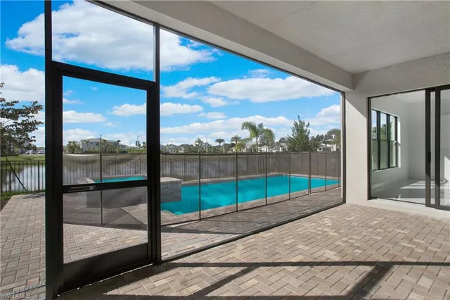 a view of a room with wooden floor and iron stairs