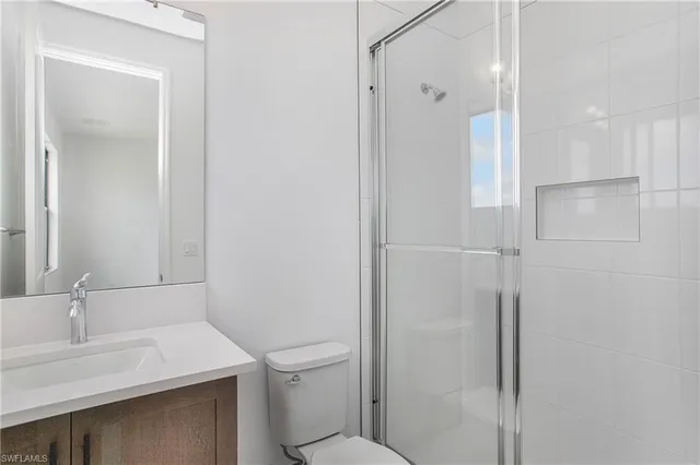 a bathroom with a sink toilet and vanity