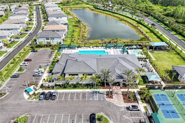 an aerial view of a residential houses with outdoor space