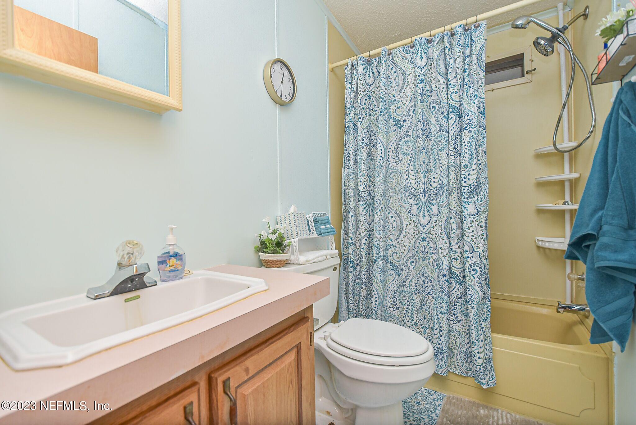 136 Lawrence Lane Georgetown, FL 32139 - Photo 17 of 33 a bathroom with a sink toilet and shower