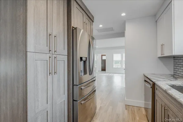 a view of a kitchen from the hallway