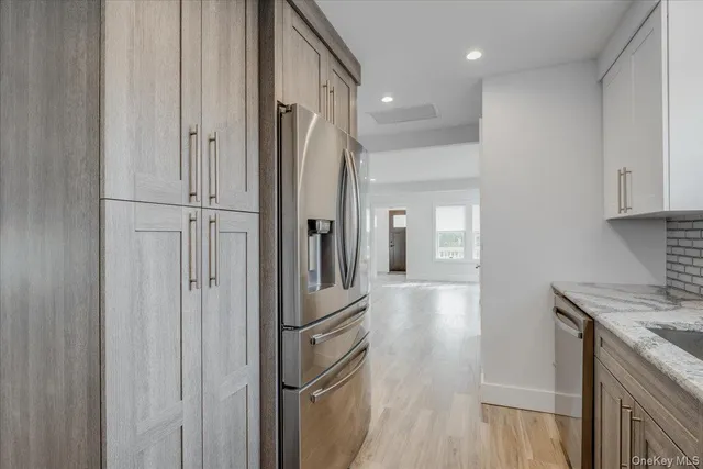 a view of a kitchen from the hallway