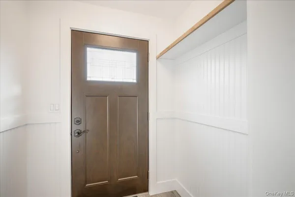a bathroom with a window and a shower