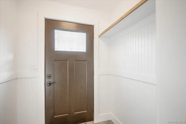 a bathroom with a window and a shower