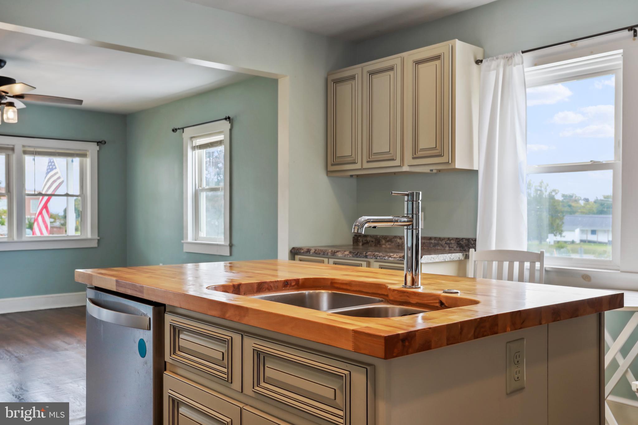 217 Poorhouse Road Winchester, VA 22603 - Photo 11 of 39 a kitchen with kitchen island a sink table and chairs