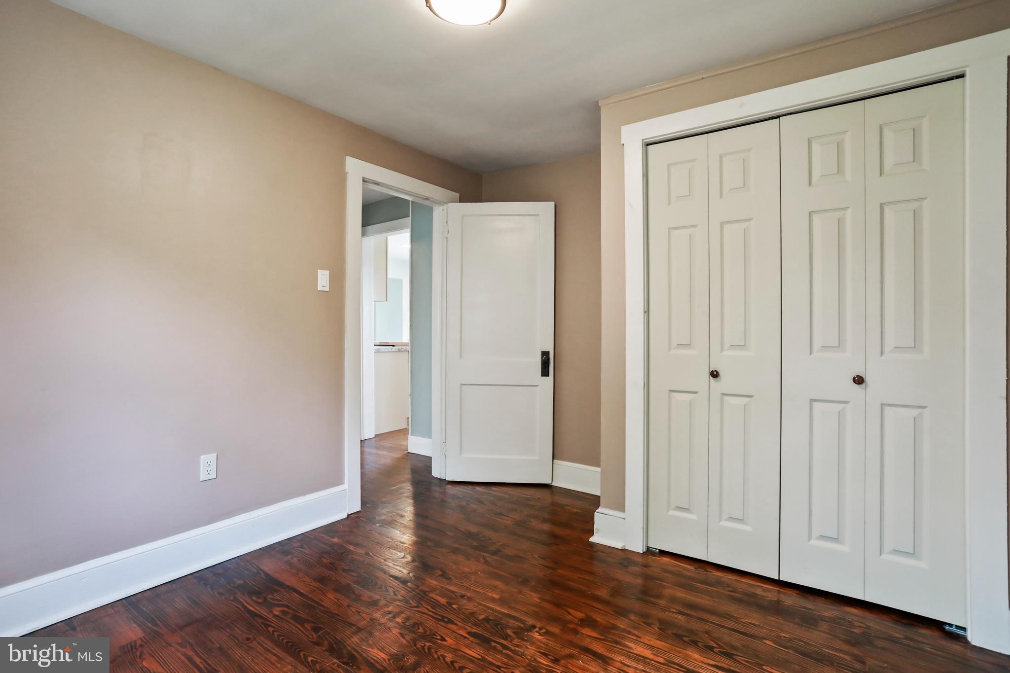 217 Poorhouse Road Winchester, VA 22603 - Photo 16 of 39 a view of an empty room with wooden floor