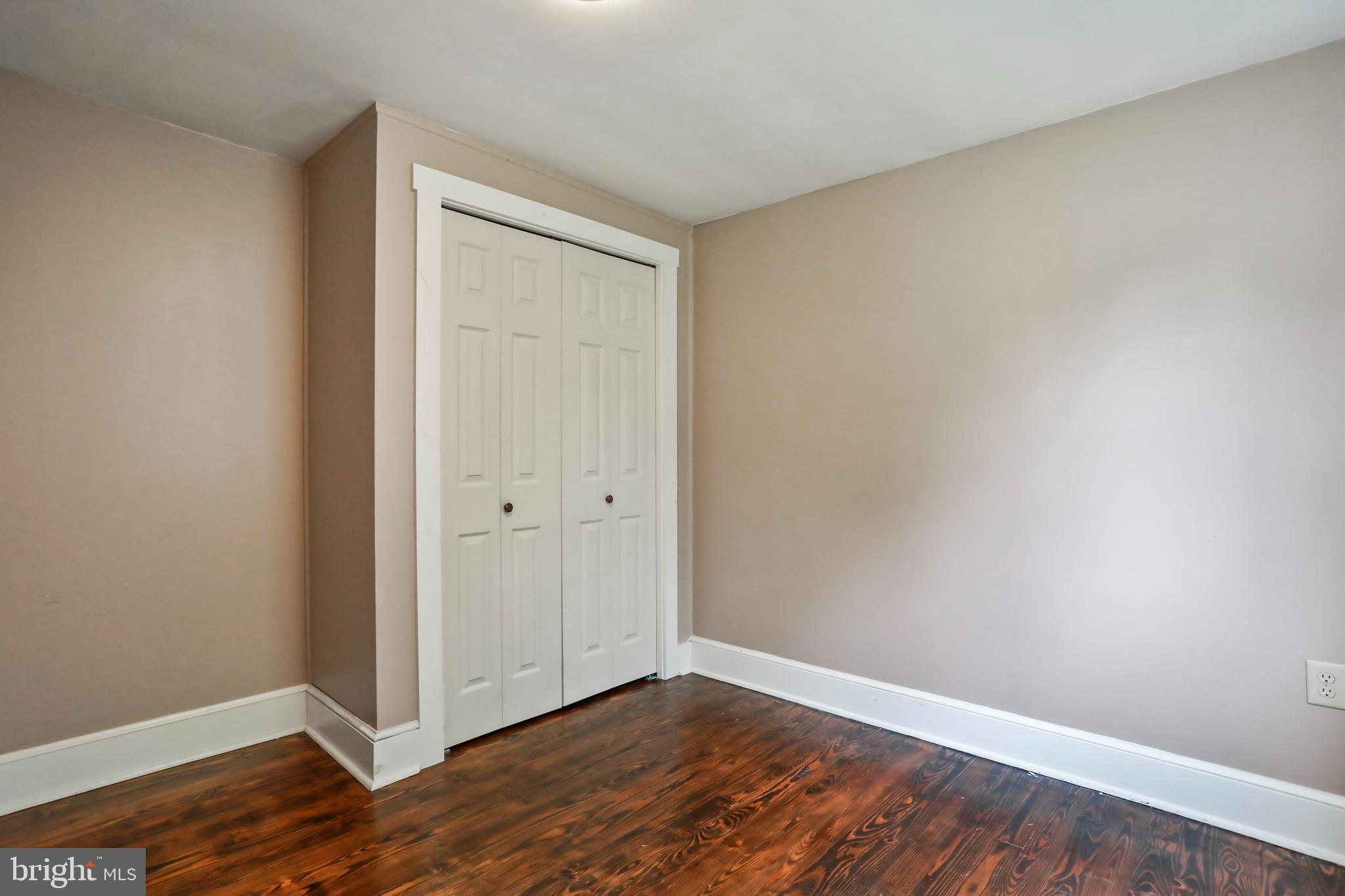 217 Poorhouse Road Winchester, VA 22603 - Photo 17 of 39 a view of an empty room with wooden floor