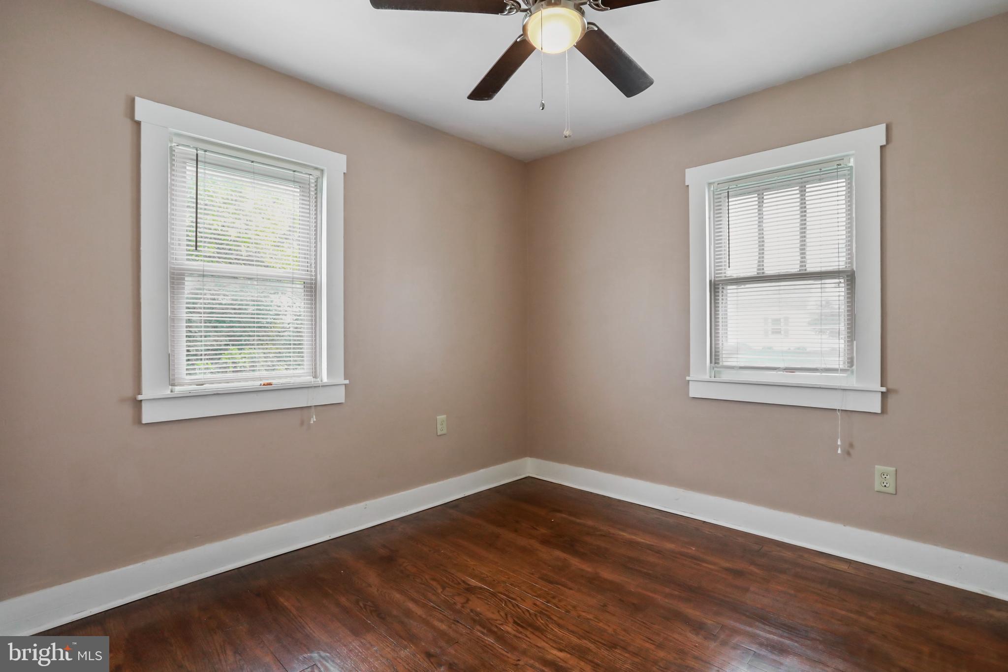 217 Poorhouse Road Winchester, VA 22603 - Photo 20 of 39 a view of an empty room with wooden floor and a window