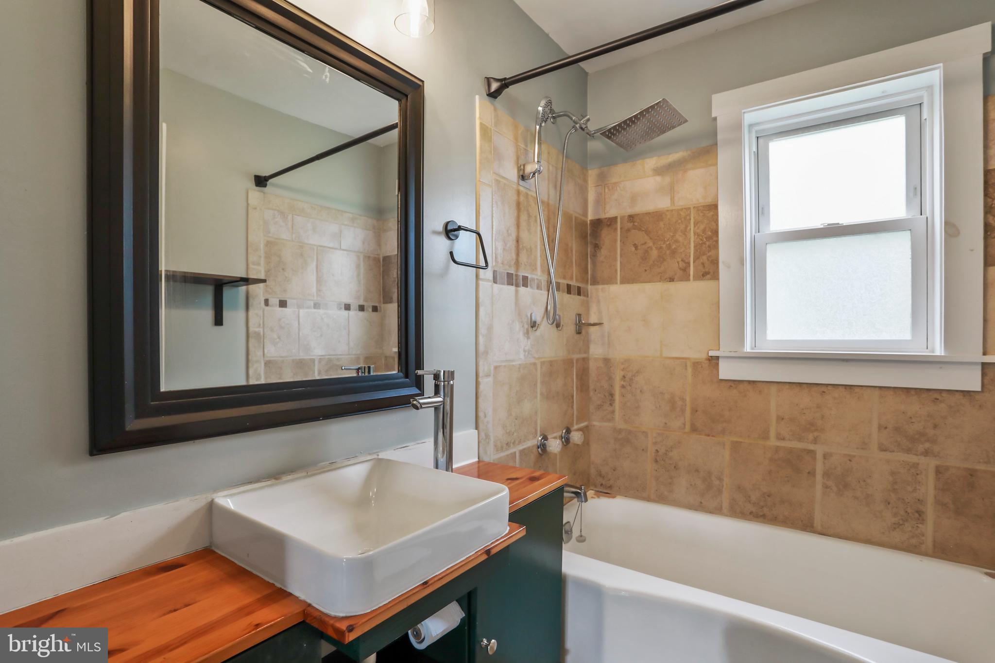 217 Poorhouse Road Winchester, VA 22603 - Photo 22 of 39 a bathroom with a sink and a bathtub