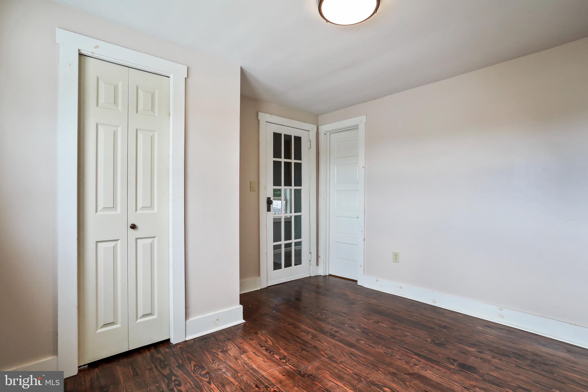 217 Poorhouse Road Winchester, VA 22603 - Photo 24 of 39 a view of an empty room with wooden floor