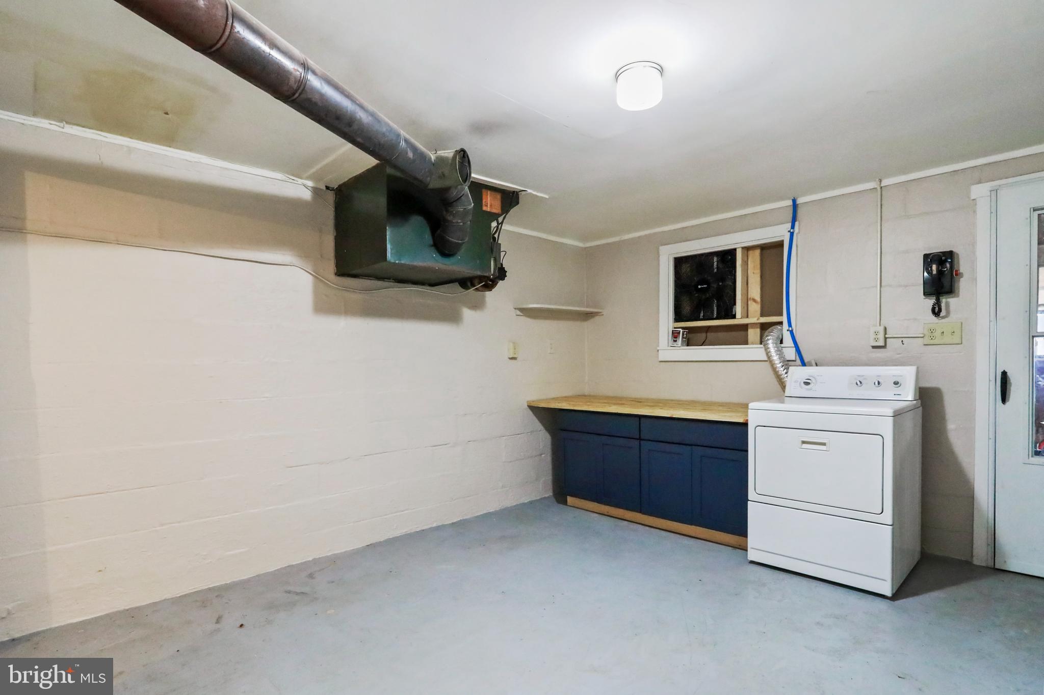 217 Poorhouse Road Winchester, VA 22603 - Photo 33 of 39 a room with a sink and a bed