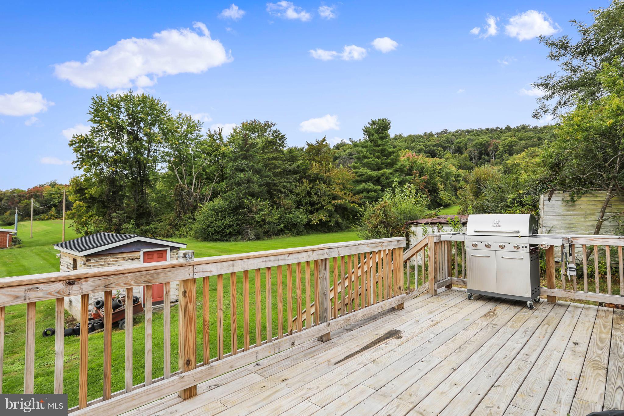 217 Poorhouse Road Winchester, VA 22603 - Photo 36 of 39 a view of a balcony with wooden floor and fence