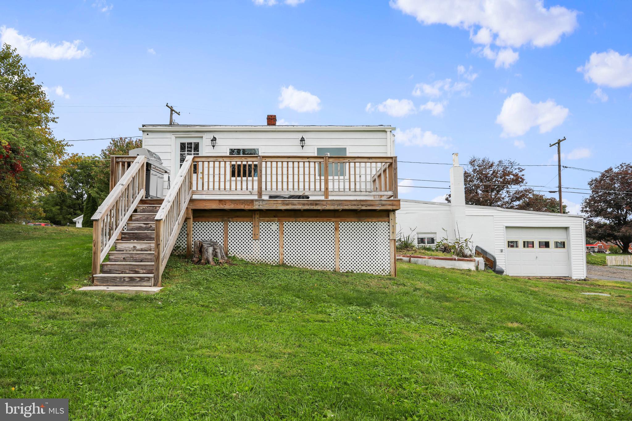 217 Poorhouse Road Winchester, VA 22603 - Photo 37 of 39 a view of a house with a yard porch and sitting area